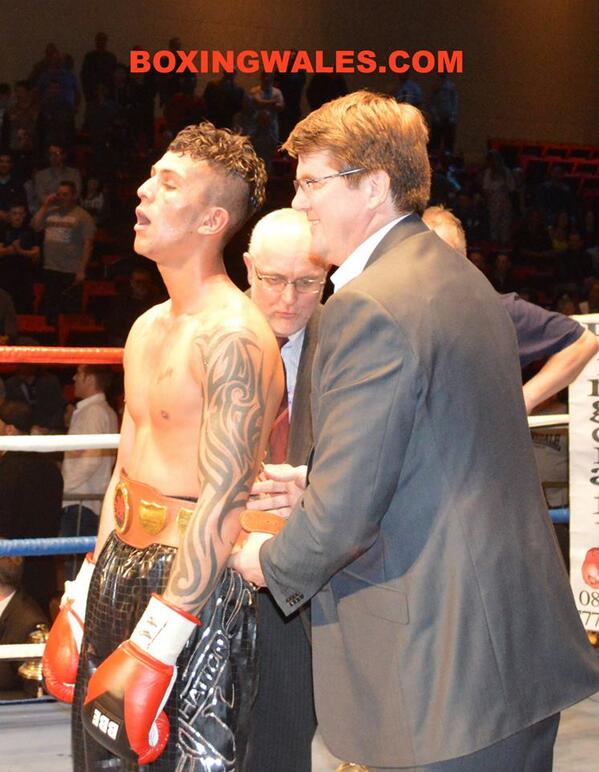 MasbeMoney's tweet photo. An exhausted Jerome @BoxerBack Samuels is awarded the Welsh title from former champ Nicky Piper. #EnterTheDragon http://t.co/Bu3NzMTB7R