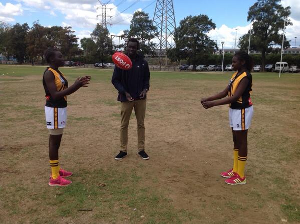 afldiversity's tweet image. Our @auspost #multicultural ambassador @majakdaw doing handball drill with his sisters who r playing in #UnityCup2014