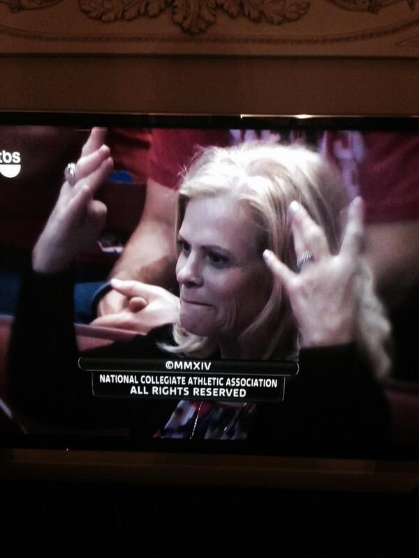 Lady at the end of the Wisconsin game throwing up signs