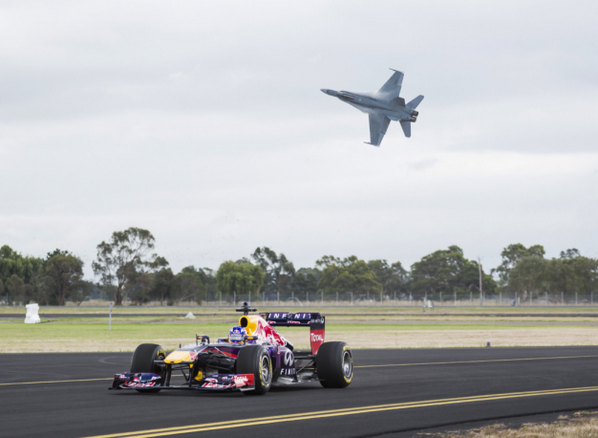 CARandDRIVER's tweet photo. WATCH: @RedBull @RedBullRacing @F1 car race an F/A-18 Hornet fighter jet! http://t.co/bslJCDC0qw http://t.co/zoZ9kENQrn