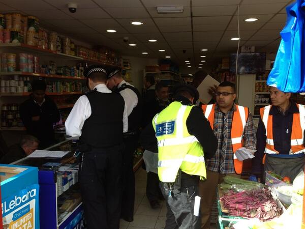 MPSTowerHam's tweet photo. #BigWing @TowerHamletsNow #TradingStandard police jointly combating illegal traders & counterfeit goods Whitechapel http://t.co/JpKwiSi7bg
