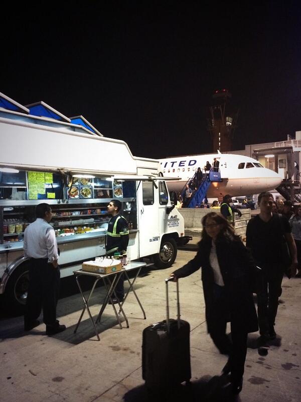 Landed at LAX but jet bridge was busted. Someone parked a taco truck outside the air stair. #genius #legal?