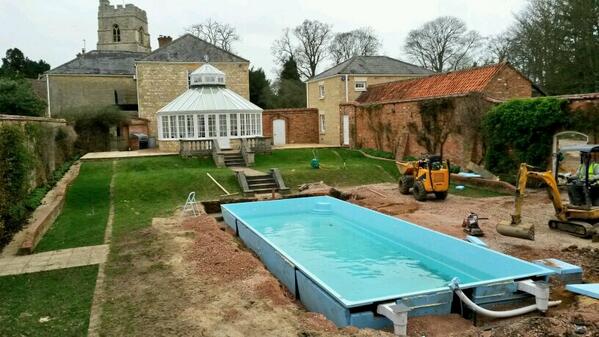 sunquestpoolsUK's tweet photo. A very English #OnePiecePool installation this week. Church was even flying St.George flag! http://t.co/jPsHcub8D9