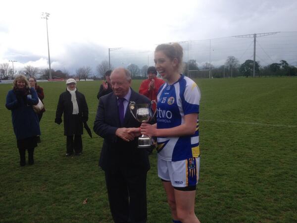 LadiesFootball's tweet photo. St. Pat's Drumcondra captain Niamh Tighe receives the Lynch Cup from LGFA President Pat Quill #oconnorcup http://t.co/6iTaYeOzSt
