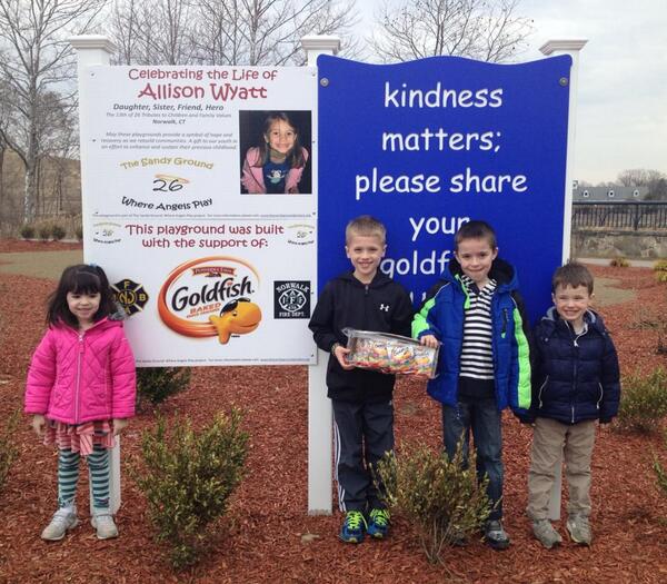 Sharing their Goldfish crackers at Allison's playground, just as she would do.  Kindness Matters <3