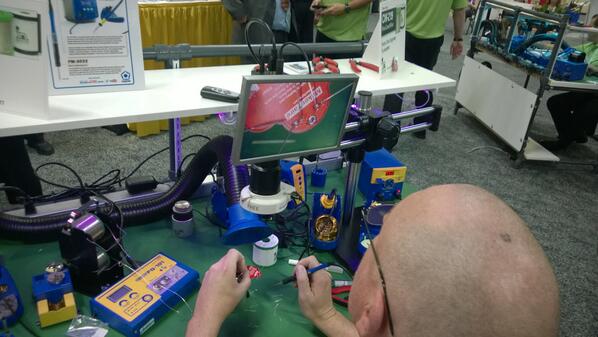 netduino's tweet photo. At #IPCshow in Las Vegas, @HakkoUSA is "teaching people how to solder" using #MakerFaire LED robot pins. Pretty cool! http://t.co/hSwikz6TYu