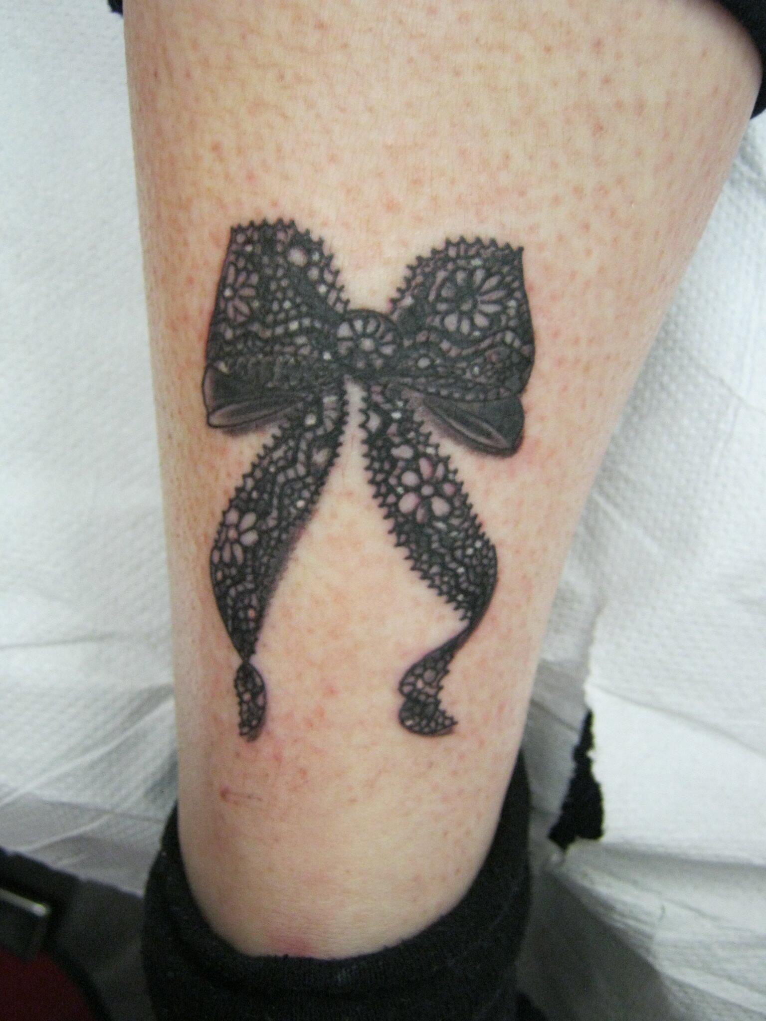 black lace bow tattoo