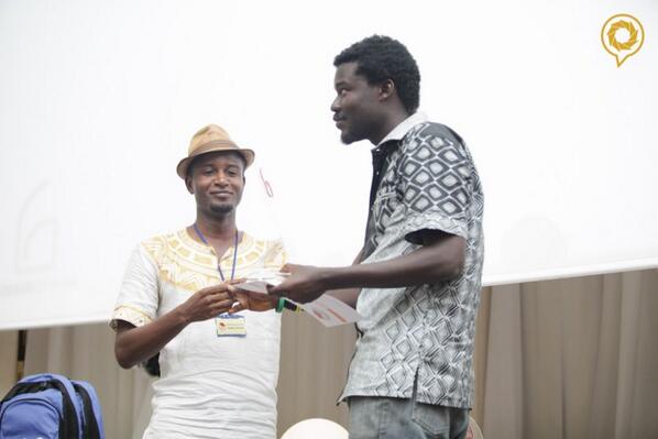 BloggingGhana's tweet photo. .@kobbygraham presenting another award to @MutomboDaPoet at #BlogCamp13 . #BloGh http://t.co/Azo1hieqyn