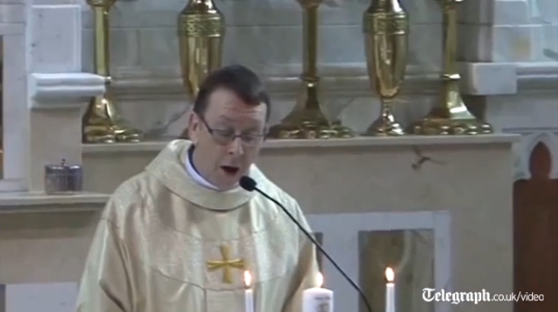 Telegraph's tweet photo. VIDEO: Priest moves bride to tears with surprise rendition of 'Hallelujah' at the altar  http://t.co/CJ3wzsz9FR http://t.co/jEtBWbyMrS