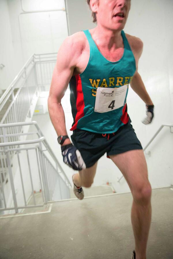 runyonup's tweet photo. An action shot of our top finisher, Tim Donahue, arriving at the 72nd Floor!! http://t.co/6fdyia1LbG