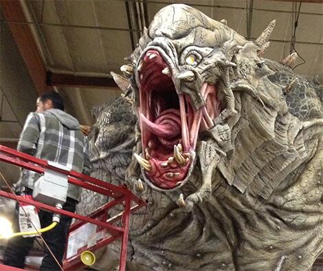 2K's tweet photo. Our #PAXEast booth is coming together nicely! Looking to play @EvolveGame this weekend? Watch out for this guy... http://t.co/hb8fMURQ7c