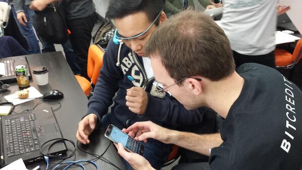 Alex helping a participant to hack the Google Glasses to pay just by looking at an item!  #bitcoinexpo #Bitcredits