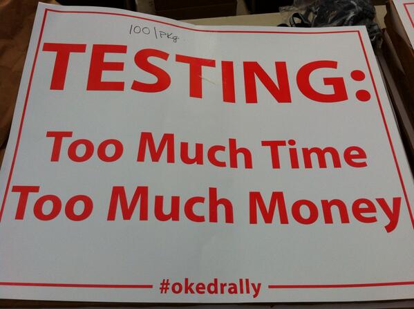 OklahomaWatch's tweet image. Members of the Oklahoma Education Association pass out stickers and banners to people arriving at the #OKEdRally.