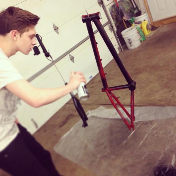 Jordan spray painting his bike getting ready for this nice weather to come so we can ride!!!