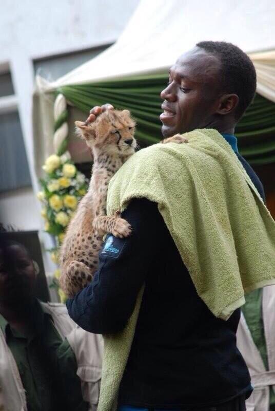 CauseWereGuys's tweet photo. Usain Bolt and his son http://t.co/7oO0GzaYOe