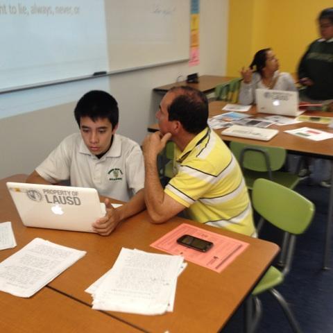 YOKADragons's tweet photo. Student shows parent what he is learning in class. http://t.co/Uy0To8ARta