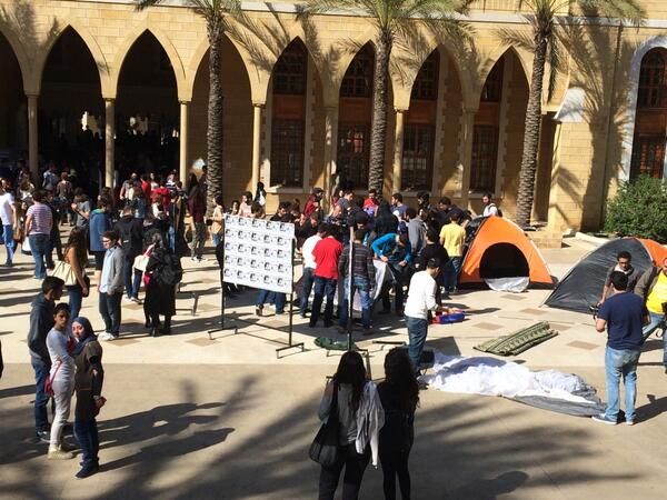 haya_atassi's tweet photo. #AUB students setting up tents for an open sit-in 
#OccupyCollegeHall 
#occupy_aub 
@STFI_AUB http://t.co/XdJA2OJ9Oj