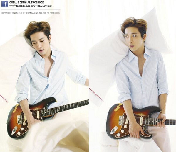 allkpop's tweet photo. CNBLUE's Yonghwa poses with his guitar on a bed for 'Harper's Bazaar China' http://t.co/LYOQQhOpHy http://t.co/MG9y3EA1ib
