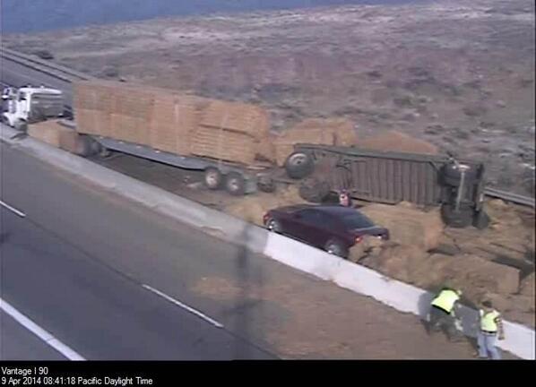 wsdot's tweet photo. Hay truck hit equipment in work zone, overturned on WB I-90. Cleanup will likely take a few hours. #wzsafety http://t.co/bqiugu2Hmc