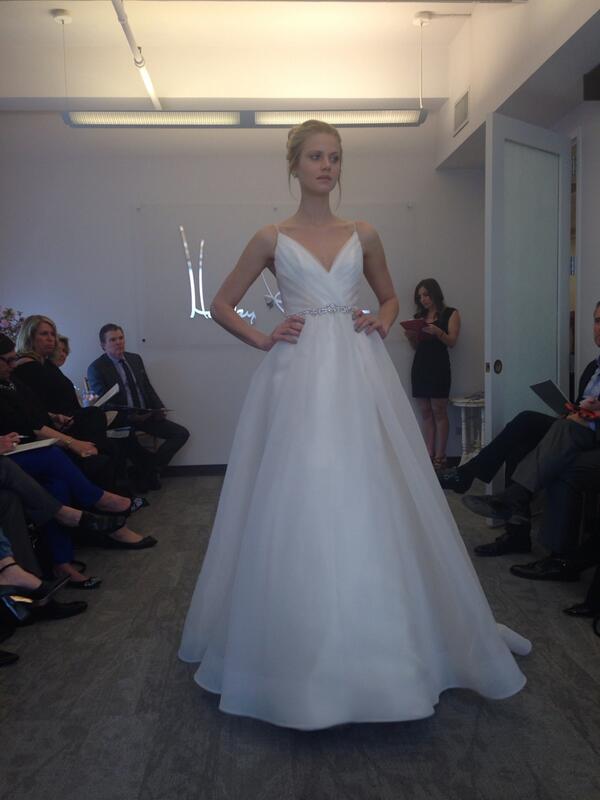 A blush and ivory organza ball gown with two-tone pleated crossover bodice from <a href="/BlushbyHP/">Blush</a> #bridalmarket