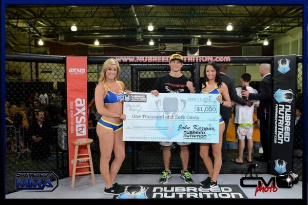 RFAfighting's tweet photo. @AlanJouban flanked by @KaylaRauer &amp; @MsLeandraWarren w/ his @NubreedNTN "@NubreedAthlete of the Night" check. #RFA14 http://t.co/qhSzi0Ahwn
