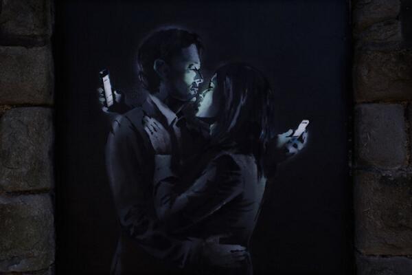 nathanjurgenson's tweet photo. lol banksy is as edgy as an old Atlantic cover MT @laurenonizzle: Banksy's New Piece is a Comment on Smartphones  http://t.co/MFP1AKg2yl