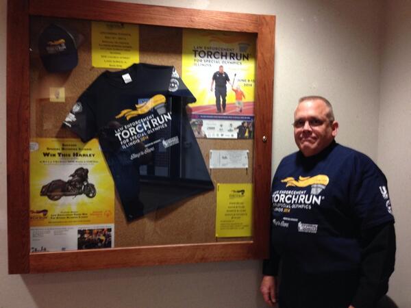 Sgt Yundt is showing this years Torch Run for Special Olympics Illinois tshirt all items on sale at PD <a href="/SO_Illinois/">Special Olympics Illinois</a>