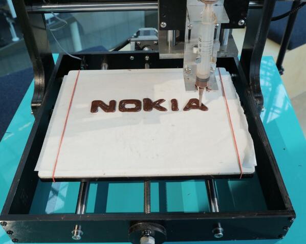 nokia's tweet photo. Nokia and 3D printing meet Chocolate leading to #EdibleTech... Enjoy: http://t.co/2fYVFJC7N1 #Chokia http://t.co/RwwzJoJpx0