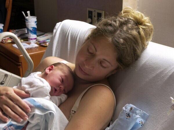 -lays in the hospital bed holding her new born a little drugged up not really expecting anyone to visit- #OpenRP