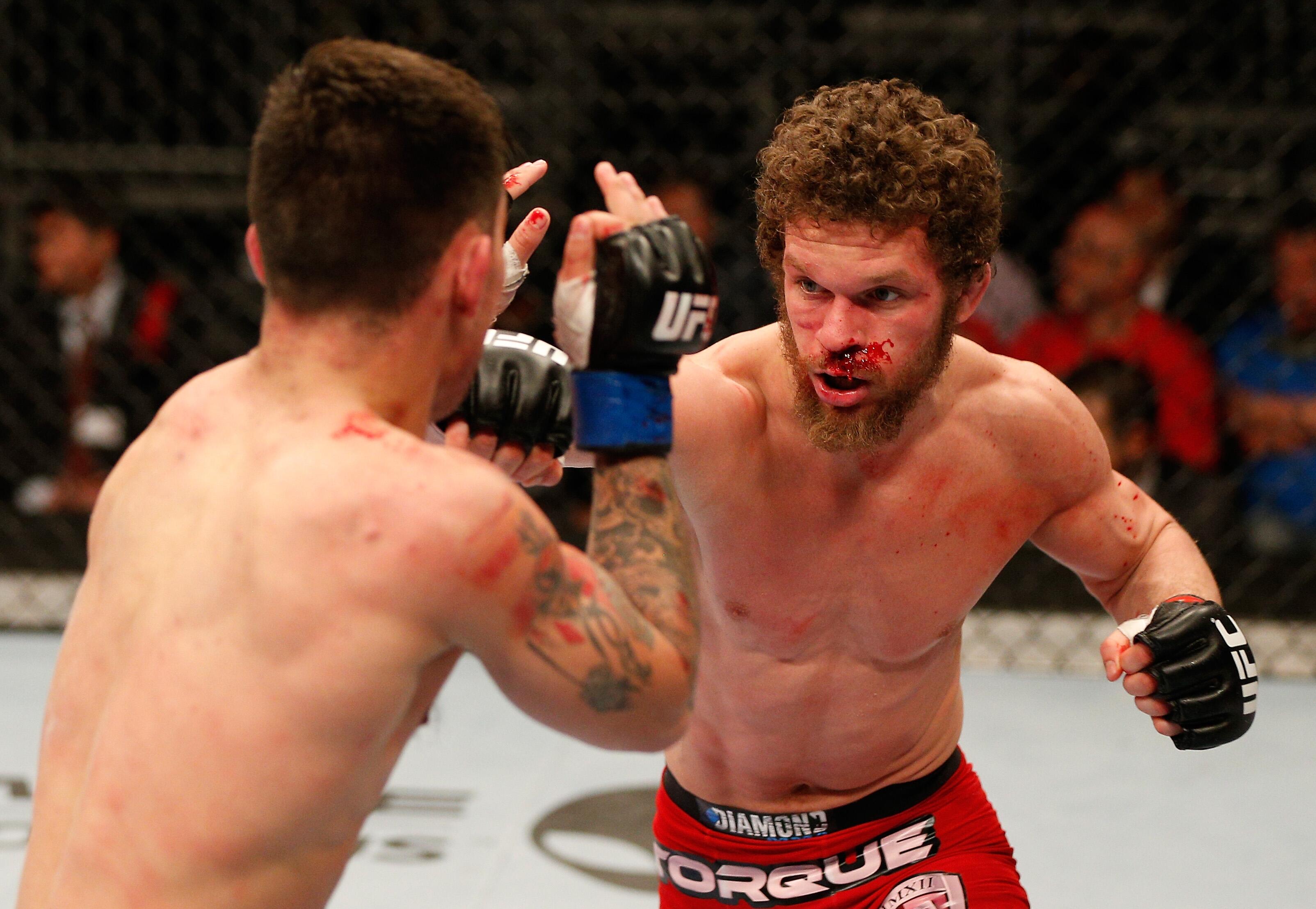 Dustin Ortiz attacks Joseph Benavidez during their first bout in 2014 (UFC/Getty Images)