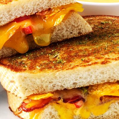 The Weekly Special: The Dirty Melt. Aged cheddar. Jalapeño. Bacon. Tomato. BBQ chips. Sourdough. Boom.