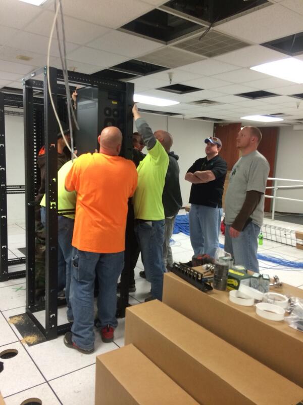 How many guys does it take to mount a Cisco catalyst switch??