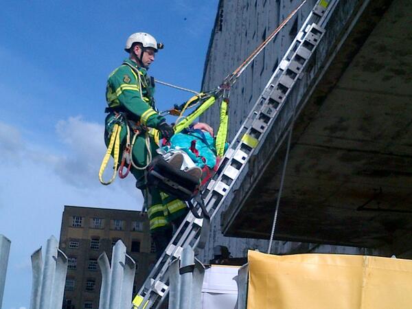LondonFire's tweet image. Our @Ldn_Ambulance colleagues 'rescue' this person from the roof of the building. Nice weather for #emergencyexercise