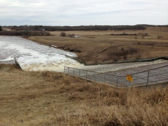 RonKrahn's tweet image. Inner tubing anyone?  Pretty high flows off of Rivers Lake spillway into the Little Saskatchewan River #spring14