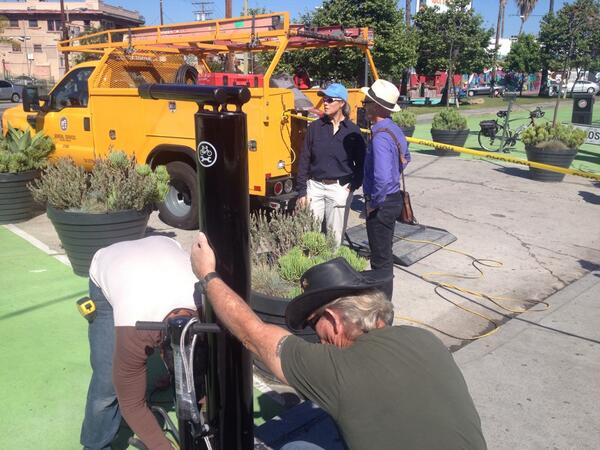 LADOTBikeProg's tweet photo. Bike repair station install with @MitchOFarrell at Sunset Triangle Plaza. Thanks to sponsor @pineandcrane ! http://t.co/92Ec2TKPGs