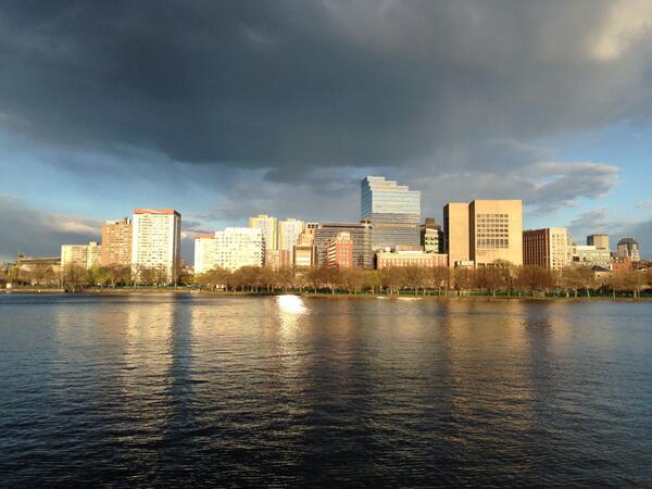 The sun casting awesome light over the Charles tonight under ceiling of dark clouds #BeautifulBoston