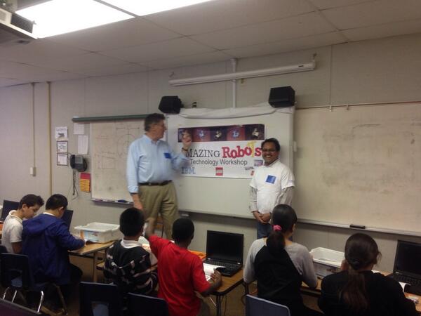 LynnGuest1's tweet photo. Great IBM volunteers Naidu and Dan explaining robotics to 5th graders @IBMVolunteers http://t.co/27wPGJZCsT