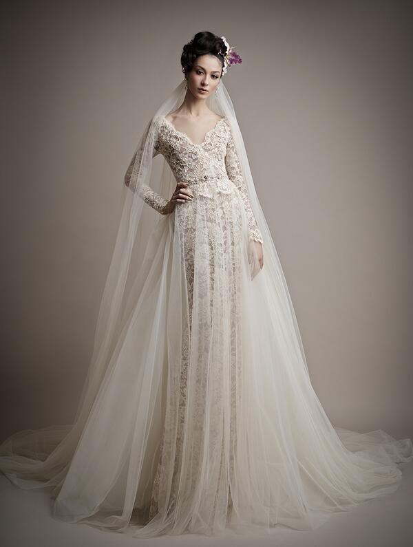 We are obsessed with this dress! The Ersa Atelier #trunkshow has begun!#ersaatelier #ersa #chicagobridal #lacesleeves
