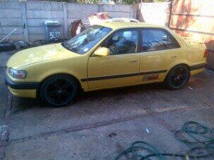 NaldoZombie's tweet photo. My yellow toyota carola rsi stolen reg nr DFY 949 and a sticker on the front window "POORBOYS conversions" DM me http://t.co/QnMy2EJUOC