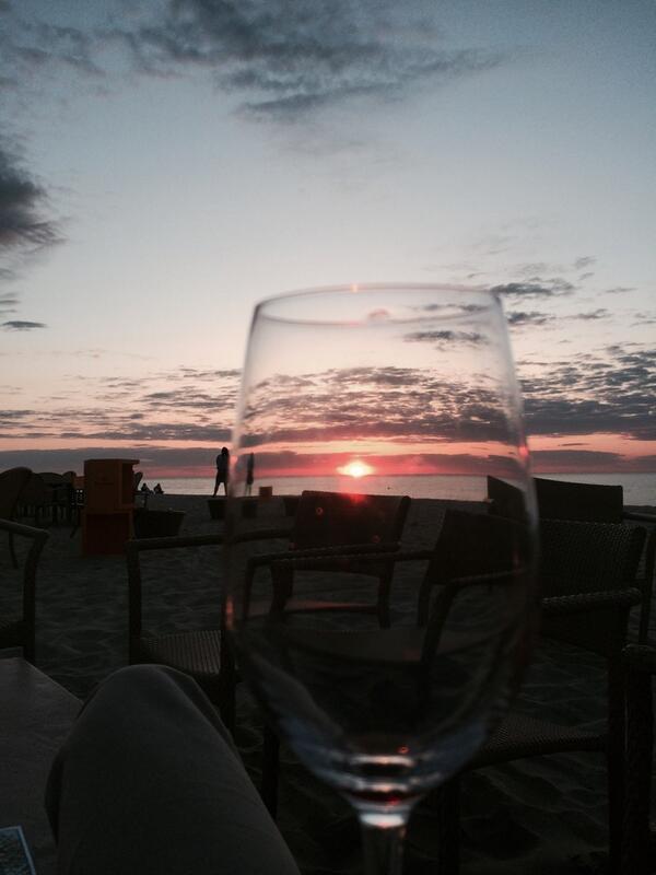 ACKTweet's tweet image. Nantucket sunset through a wine glass at @GalleyBeach