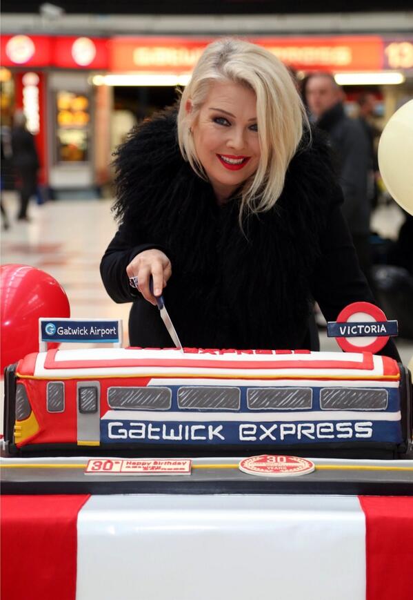 Cakes_by_Robin's tweet photo. The cake we did to celebrate the 30th birthday of @GatwickExpress being cut by @Kim Wilde today at Victoria Stn http://t.co/ZwaFuxvcyK