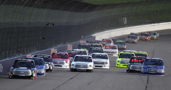 NASCAR_Trucks's tweet photo. PHOTO: @KyleBusch leads the field during last night's #NASCAR Camping World Truck Series #SFP250 at @kansasspeedway http://t.co/P7EOEcOBXq