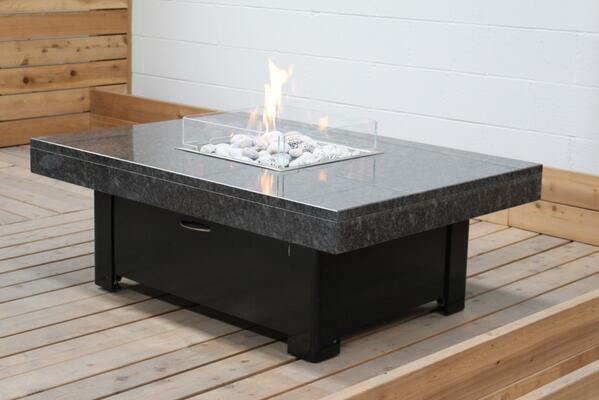 A finished Bahama Fire table with a Tornado Grey granite Top and a Black powder coated stainless steel base.