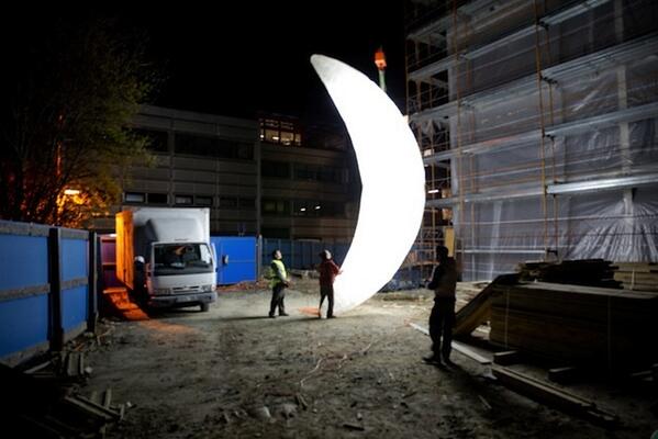 Street artist SpY hangs a giant moon over Switzlerland. bit.ly/1milVhb