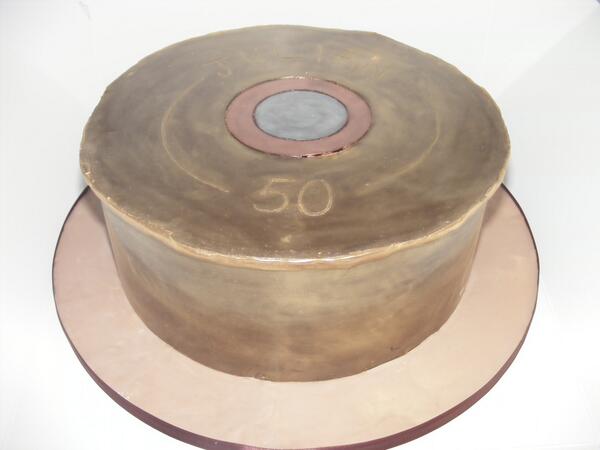 CakeChocolateMa's tweet photo. Just had this cake collected. 10" chocolate cake decorated to represent a shotgun cartridge http://t.co/GMdDjHH7A0