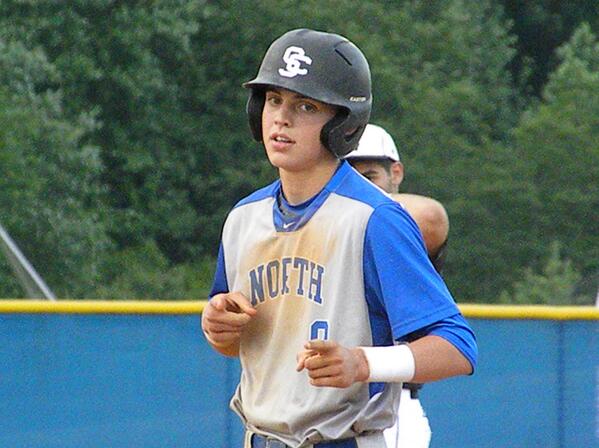 Always the showman, <a href="/NMHSAthletics/">NMHS Athletics</a> River Ryan poses at first last night. The younger Ryan's pretty good, too