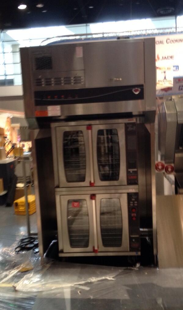 EE working hard setting up the WVU-48 ventless hood w/ <a href="/LangMfg/">Lang Manufacturing</a> ovens under it. #middlebyinnovation #middlebynra2014