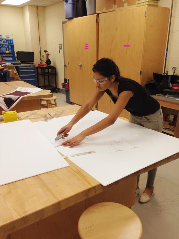 Storganized's tweet image. Here, we have our Marketing Director making a "cutting" edge packaging.