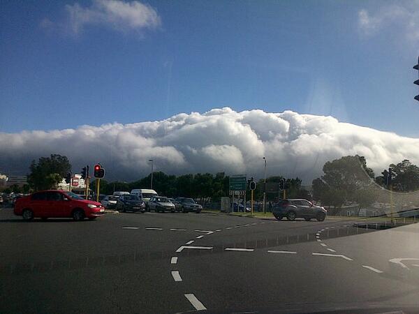 CapeTown's tweet photo. wooha! "@B0kk13: Clouds boiling over @TableMountainCa and wind pumping. Hello, Winter! #capeweather #winter http://t.co/SB7qRnEofo"
