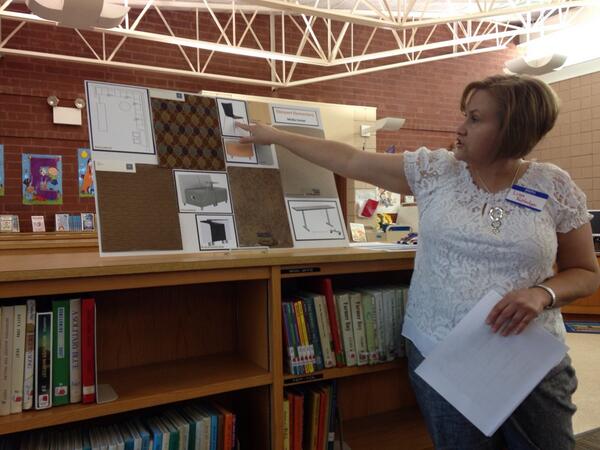SiC listening to plans for media center upgrades from our media specialist, Lisa Rutledge.